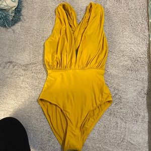 Plunge neckline one piece swim suit